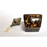 A 19TH CENTURY TORTOISESHELL DOUBLE NEEDLE PACKET BOX the sloping hinged lid with white metal