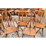 A SET OF FOUR ERCOL 'SWAN BACK' WINDSOR ARMCHAIRS Condition Report : solid, but tatty in places,