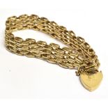 A 9CT GOLD HEART PADLOCK GATE BRACELET Length 17.5cm approx, weight 24.7g Condition Report : Padlock