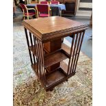 AN EDWARDIAN OAK REVOLVING BOOKCASE 48cm square, 88cm high Condition Report : generally good