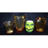 THREE WHITEFRIARS AMBER GLASS VASES: a lobed vase model 9376 designed by James Hogan; another 26cm