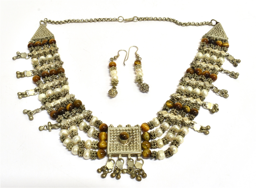 A YEMINI BAROQUE PEARL, TIGERS EYE COLLAR NECKLACE AND MATCHING EARRINGS The necklace of white metal