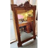 A LARGE 19TH CENTURY GILT GESSO FRAMED MIRROR the top with rococo moulded scroll, 158cm x 94cm