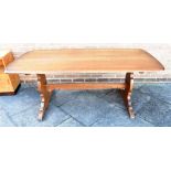 AN ERCOL REFECTORY DINING TABLE the rectangular top 88cm x 183cm, on shaped supports united by