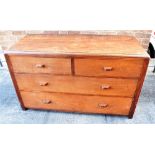 A TEAK AND OAK CHEST OF TWO SHORT AND TWO LONG DRAWERS in the manner of Gordon Russell, the