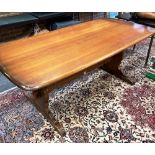AN ERCOL REFECTORY DINING TABLE the rectangular top 88cm x 183cm, on shaped supports united by