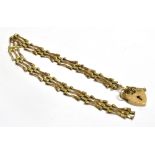 A SMALL 9CT GOLD HEART PADLOCK BRACELET A/F, bracelet broken, heart padlock working, measurement 1 x