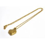 A 9CT GOLD HEART PENDANT WITH CHAIN The heart pendant (sealed locket?) measuring approx. 1.7cm X 1.
