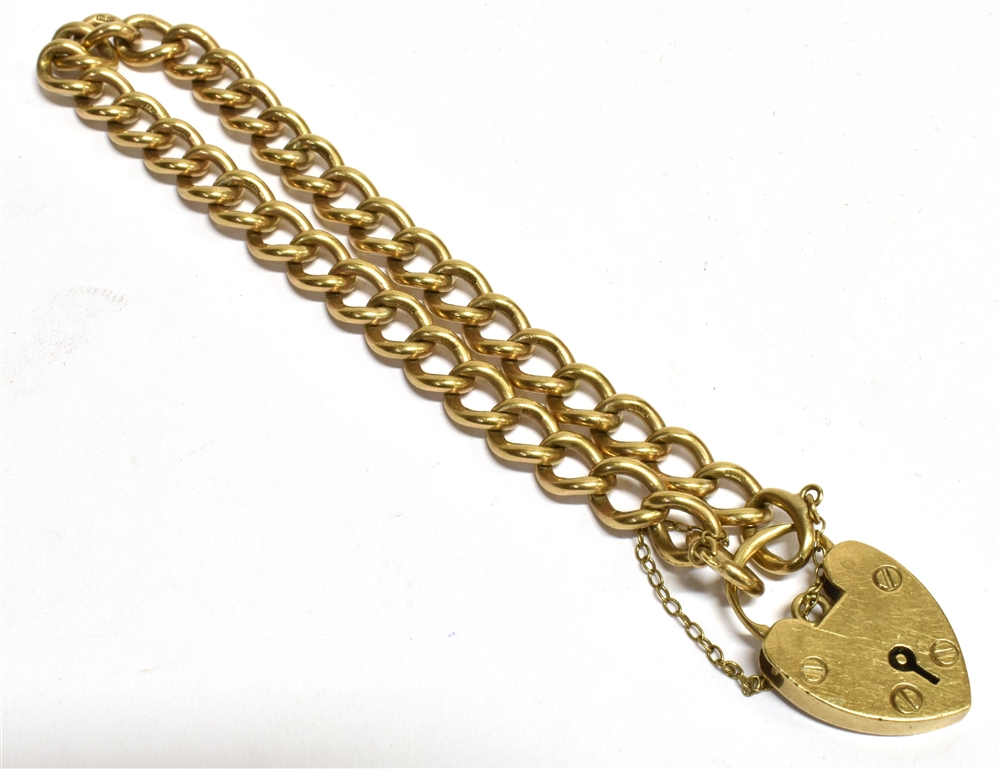 A 9CT GOLD HEART PADLOCK CURB LINK BRACELET and safety chain, chain width 6mm, weight 21g