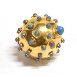 A TURQUOISE SET YELLOW METAL GLOBE PENDANT PIECE The globe pendant set with numerous turquoise