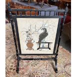 A VICTORIAN EBONISED FIRE SCREEN with tapestry panel, 70cm wide 108cm high Condition Report : broken