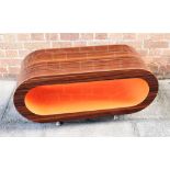 A ROSEWOOD EFFECT COFFEE TABLE on metal supports, 91cm wide 35cm deep 45cm high