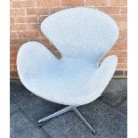 A REFRO SWIVEL ARMCHAIR on four prong metal base, in the manner of Arne Jacobsen / Fritz Hansen '