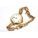 A 15CT GOLD CASE VINTAGE WRISTWATCH anonymous white enamel dial, black Arabic numerals (Red 12),