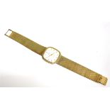 OMEGA A 9CT GOLD OMEGA WRISTWATCH The signed white dial with black roman numerals, gilt batons and
