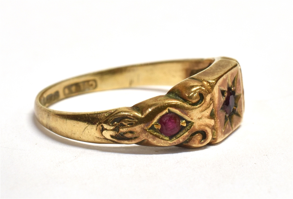 A VINTAGE 9CT GOLD RUBY GYPSY RING The ring set with three round cut rubies, the central ruby star - Image 2 of 3