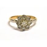 VINTAGE MARKED 18CT PLAT DAISY DIAMOND RING The diamond daisy set in platinum on a yellow gold