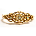 A VINTAGE 9CT GOLD OPAL AND SEED PEARL EVERLASTING BANGLE The bangle of hollow tube design, set with