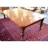 A VICTORIAN MAHOGANY EXTENDING DINING TABLE with two additional leaves, 131cm wide 214cm long