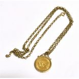 QUEEN ELIZABETH II FULL SOVEREIGN PENDANT and chain, the 1979 sovereign in an enclosed yellow
