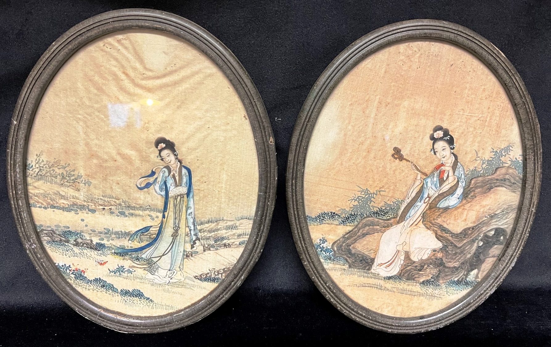A PAIR OF CHINESE OVAL PAINTINGS ON SILK each depicting a lady in landscape setting, 24.5cm x 19.5cm
