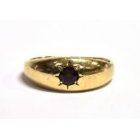 A 9CT GOLD, GARNET GYPSY RING The ring set with a single star set garnet, worn 375 hallmark to the