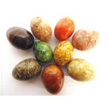 NINE POLISHED HARDSTONE EGGS the largest 7cm high.