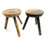 JOHN CLEAL WORKSHOP, WALES: a pair of three legged stools with tooled leather tops Condition
