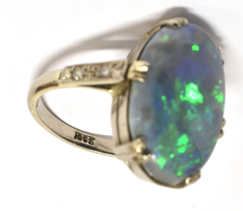 A STAMPED 18CT BLACK OPAL DOUBLET AND DIAMOND RING The large Oval Opal measuring approx. 1.9cm X 1. - Image 4 of 4