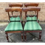 A SET OF FOUR EARLY VICTORIAN MAHOGANY DINING CHAIRS with carved bar backs, on fluted suppports
