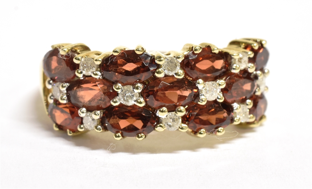 A 9CT GOLD DIAMOND AND SPESSARITE MIXED CUT CLUSTER RING The ring set with a triple band of