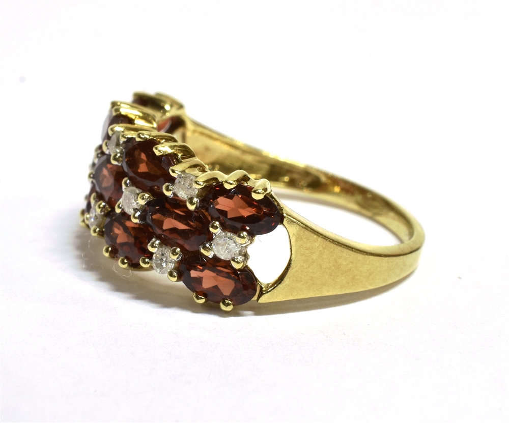 A 9CT GOLD DIAMOND AND SPESSARITE MIXED CUT CLUSTER RING The ring set with a triple band of - Image 3 of 3