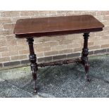 A MAHOGANY SIDE TABLE on carved supports united by stretcher, the rectangular top 48cm x 92cm,
