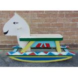 A PAINTED WOOD ROCKING HORSE on shallow bow rockers, overall 91cm long.