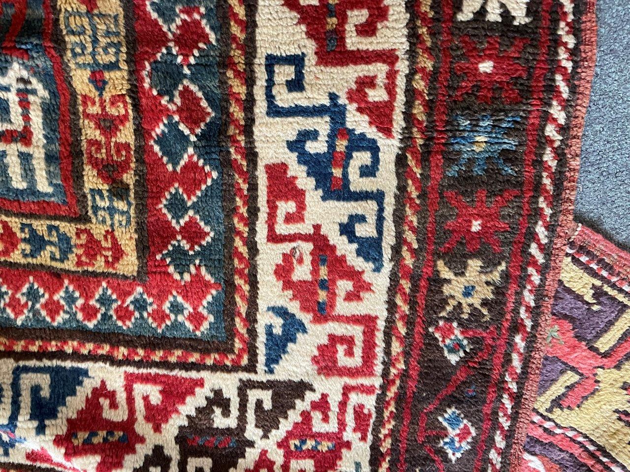 A RED/BLUE GROUND RUG decorated with two medallions and stylised animals, 205cm x 151cm - Image 6 of 7