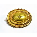 LATE 19TH/EARLY 20TH CENTURY OLD CUT DIAMOND STAR SET ETRUSCAN STYLE PHOTO BROOCH The oval tiered