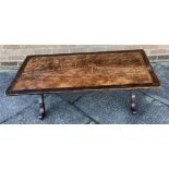 JOHN CLEAL WORKSHOP, WALES: a coffee table, the leather top with Celtic decoration, 61cm x 122cm,