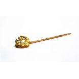 A CASED VICTORIAN CRESCENT MOON AND STAR STICK PIN The stick pin head made up of a graduated seed