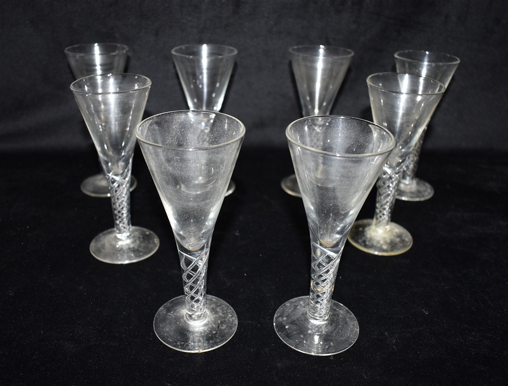 A SET OF EIGHT WINE GLASSES with trumpet shaped bowls and air twist stems, 15cm high Condition