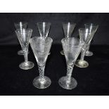 A SET OF EIGHT WINE GLASSES with trumpet shaped bowls and air twist stems, 15cm high Condition