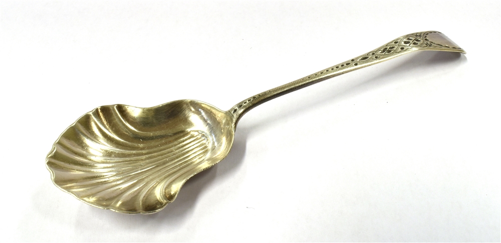 A 19TH CENTURY SILVER CADDY SPOON the spoon with bright cut handle and fluted shell bowl, lion