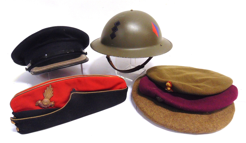 MILITARIA - A SECOND WORLD WAR BRITISH STEEL HELMET dated 1940 to the rim, later painted, with liner