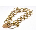 A VINTAGE MARKED 9CT GOLD HEART PADLOCK CIRCLES BRACELET Width 1.8cm, length 9cm, with working heart
