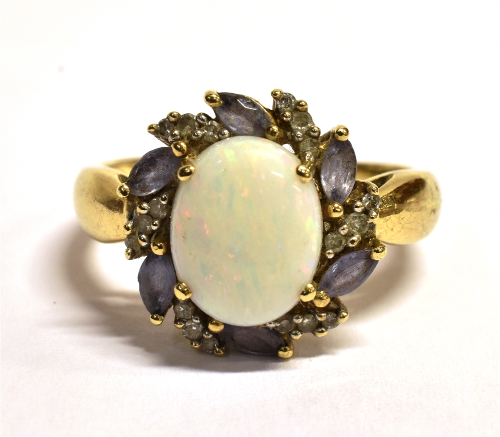 QVC 9CT GOLD OPAL CLUSTER RING The oval white Pinfire opal measuring approx 1 x 0.8cm in a mount