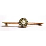 A DIAMOND AND CULTURED PEARL FLOWER HEAD BAR BROOCH The early to mid 20th Century bar brooch,