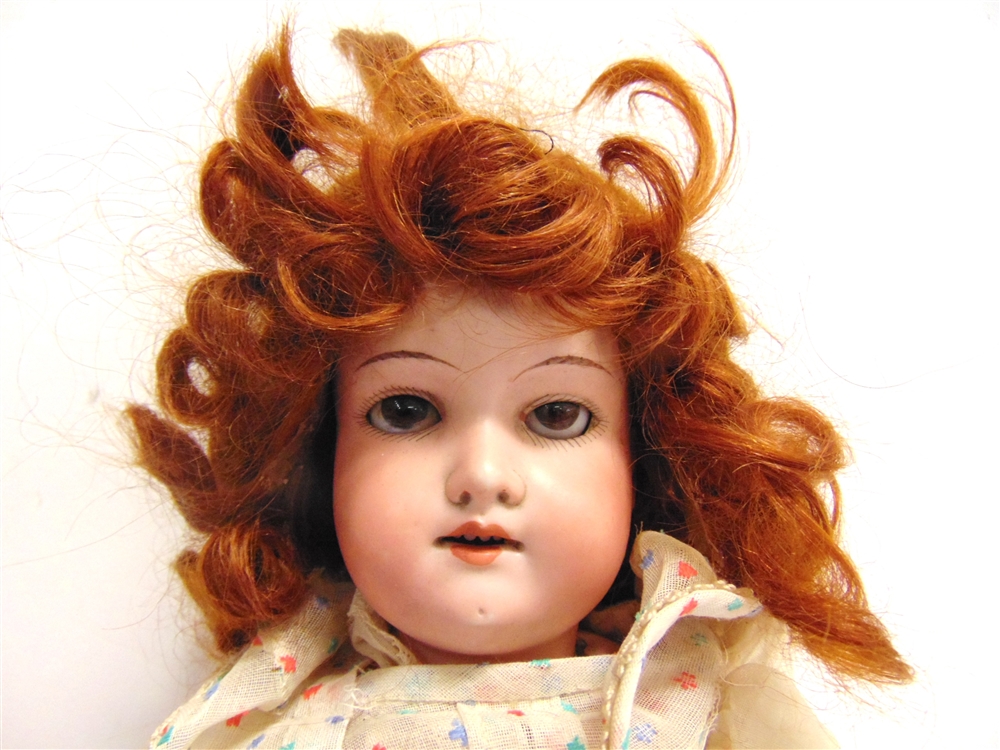 AN ARMAND MARSEILLE BISQUE SOCKET HEAD DOLL with a long curled auburn wig, sleeping brown glass - Image 2 of 2