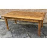 A PITCH PINE AND OAK KITCHEN TABLE with drawer to one end, on square tapering supports, the plank