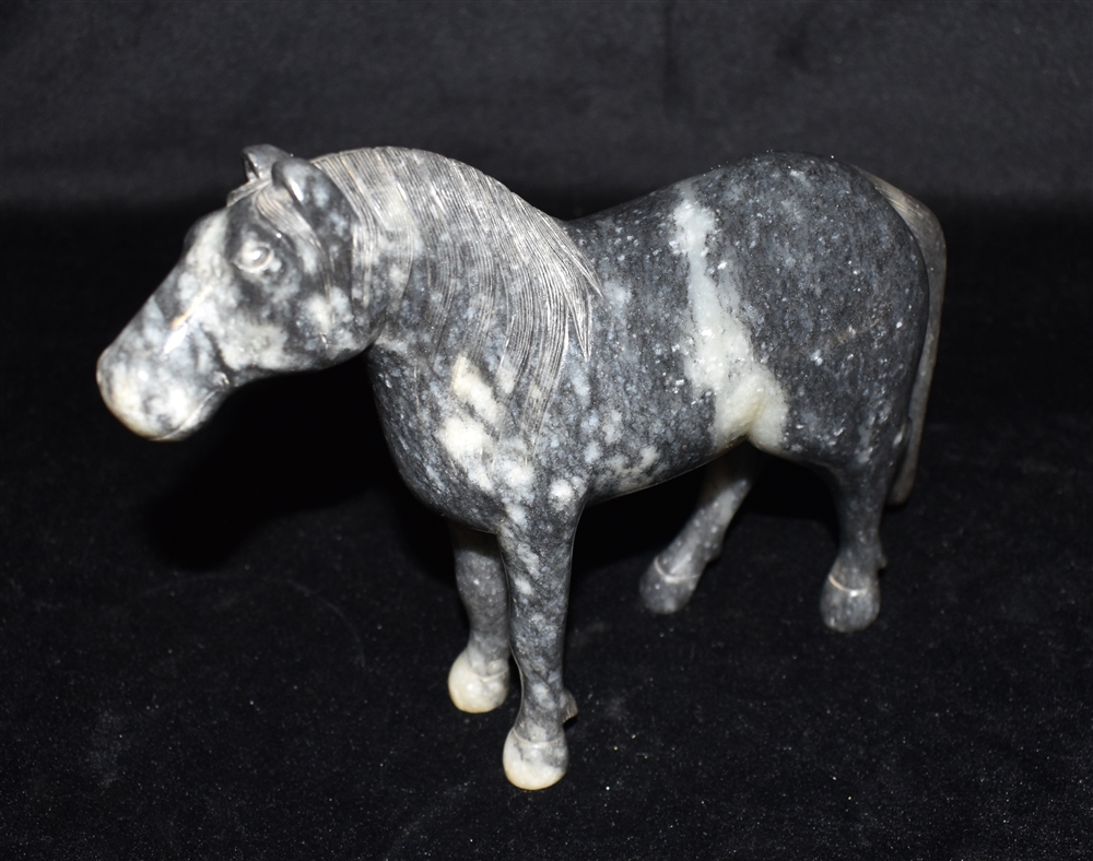 A CHINESE CARVED HARDSTONE FIGURE OF A HORSE with finely carved mane and tail, 16cm high Condition