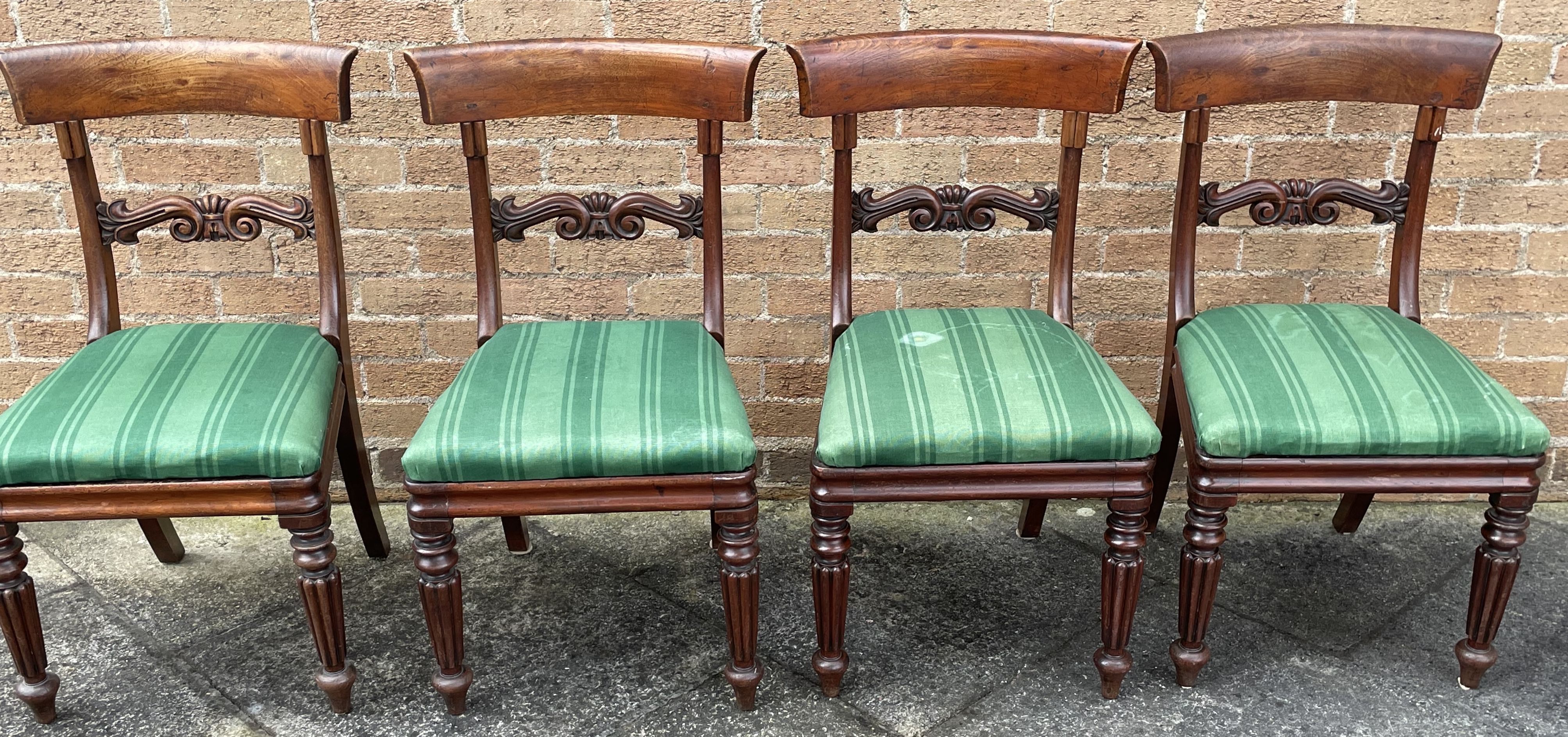 A SET OF FOUR EARLY VICTORIAN MAHOGANY DINING CHAIRS with carved bar backs, on fluted suppports - Image 2 of 2