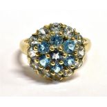 QVC 9CT GOLD GEM CLUSTER RING The ring set with seven round cut sky blue gemstones and 12 pale